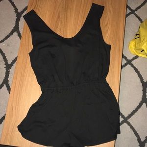 Black romper with cutout and bow in back